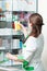 Pharmacy chemist woman in drugstore