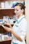 Pharmacy chemist woman with tablets