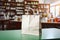 Pharmacy counter paper bag amid health products, blurred store backdrop