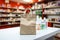 Pharmacy counter with a paper bag, health products on shelves