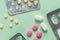 Pharmacy drugs, tablets in packages on a simple green background, painkillers and other medical products