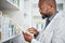 Pharmacy, medicine and black man with tablet to check inventory, stock and medication for online prescription