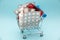 Pharmacy medicine. Shopping cart with pills and medical supplies on blue