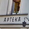 Pharmacy sign, on the wall of an old building in Krakow. Poland.