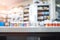 Pharmacy store counter, featuring a backdrop of blurred medication shelves