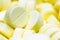 Pharmacy theme, Heap of yellow round medicine tablet antibiotic pills. Shallow DOF