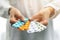 Pharmacy - woman hands holding blister packs with pills