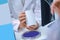 Pharmacy worker hands showing medicine packaging