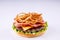 phased assembly of a hamburger on a light background1