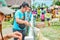 PHETCHBURI, THAILAND- JULY 21: Unidentified groups of men and women are feeding the sheep on July 21, 2013 in Swiss Sheep Farm, P