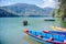 Phewa Lake with multicoloured boats in the valley of Pokhara in central Nepal