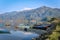 Phewa Tal (lake), with boats and Annapurna mountains range, Pokhara, Nepal