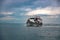 Phi Phi Island, Thailand - November 24 2019: A ferry ship with passengers onboard sailing towards the pier in Phi Phi