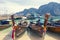 Phi Phi Islands. Thailand.  - February 10, 2019: a lot of long tail boats on tropical beach. Moored in the port on the asian