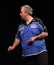 Phil Taylor throws the last dart.