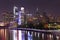 Philadelphia skyline illuminated and reflected into Schuylkill River at dusk