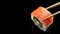 Philadelphia sushi roll with salmon, black background