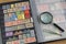 Philatelic stamp collection in quality album with magnifier and tweezers