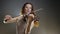 Philharmonic, musical artist playing on viola in spotlight illumination