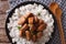 Philippine cuisine: Adobo with rice close-up. Horizontal top vie