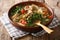 Philippine mung beans soup with pork closeup in a bowl. horizontal