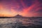 Philippine ocean sunrise silhouette, Volcano Mayon erupt cloud haze. Tropic water transport seascape