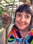 Philippines, Bahol, portrait of a beautiful girl with a small tarsier monkey.