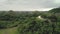 Philippines Chocolate Hills aerial view: peak`s building on Bohol Island. Beautiful road at mount