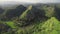 Philippines green rainforest mounts aerial view. High grass of Filipino landmark - Quitinday Hills