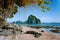 Philippines natural scenery beach at low tide, wooden bower at the tree, amazing Pinagbuyutan island in background