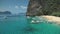 Philippines ocean bay aerial: boats and ships at turquiose water surface. Local cruise for tourists