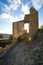 Philippsburg castle ruins with castle tower near Monreal in sunshine and a blue sky