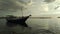 phinisi boat on losari beach at sunset