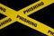 Phishing scam alert, caution and warning concept. Yellow barricade tape with word phishing.