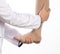 The phlebologist doctor selects the size of the patient`s compression stockings. White background, close-up