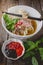 Pho Vietnamse Noodle Soup on Old Wood. Image for Food Advertise