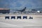 Phoenix, Arizona, USA - November 4, 2022: Baggage tractor hauling luggage across airport tarmac