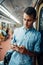 Phone addict man using gadget in metro