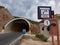 Phone booth for emergency calls near the entrance of the motorway tunnell. Transport infrastructure and safety