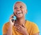 Phone call, good news or happy black woman in studio on blue background talking for communication. Mobile, face or