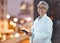 Phone, doctor and senior woman on hospital rooftop for telehealth, research or online consultation in city. Bokeh