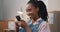 Phone, funny and black woman scroll in home, small business and social media meme. Smartphone, laughing and happy