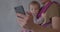 Phone in hand close up. Portrait of a child in defocus. Filtering web content