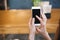 The phone in the hands of the girl. Empty Phone screen and search for applications or information on the Internet.