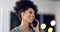 Phone, hello and black woman in office at night, happy and relaxed against blurred background. Answer, startup and