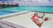 Phone - Luxury resort vacation tourist woman relaxing on overwater net bed