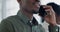 Phone, networking and business man in office with negotiation and conversation. African male professional, connection