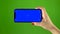 Phone screen is blue chroma key. Green screen