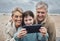Phone selfie, beach and grandparents with child bond on relax adventure, fun travel journey or Sydney Australia vacation