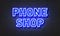 Phone shop neon sign on brick wall background.